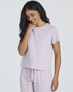 Comfortable Cotton: Indulge in the luxurious comfort of our Real Essentials 2 Pack Women's Cotton Pajamas. Crafted from soft and breathable cotton fabric, these pajama sets are designed to provide the ultimate relaxation experience, whether you're lounging at home or drifting off to sleep. Stylish Design: Elevate your bedtime routine with our stylish pajama sets, featuring short sleeve tops and capri pants. The contemporary design is perfect for warm summer nights, offering a chic and comfortabl Solid Cotton Sleepwear For Sleepover, Solid Cotton Sleepwear For Lounging, Comfortable Cotton Pajama Shorts For Relaxation, Cotton Sleepwear For Loungewear, Solid Color Cotton Sleepwear For Relaxation, Solid Color Cotton Pajama Shorts For Lounging, Comfortable Short Sleeve Tops For Sleepover, Solid Cotton Tops For Lounging, Cotton Solid Color Sleepwear For Relaxation