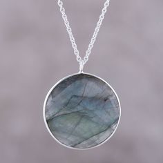 Weighing nine carats, a faceted disc of labradorite evokes the moon in this pendant necklace from India. Believed by the Inuit to possess the hues of the Aurora Borealis, the stone is framed by sterling silver. Neetu Barathi designs this necklace from India. Necklace Moon, Labradorite Necklace, Pretty Pendant, Labradorite Pendant, Jewelry Packaging, Jewelry Gift Box, Free Jewelry, Labradorite, Gemstone Jewelry