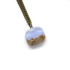 Take in the beauty of this blue lace agate square slab necklace. Add a boho beach vibe to your favorite summer look with this one-of-a-kind statement piece that resembles a gorgeous ocean scene. ITEM DETAILS: Natural gemstone - blue lace agate Nickel free Brass chain - not plated, so it won't tarnish 18 inches in length One-of-a-kind Gemstone info card included Gift ready - placed on a branded jewelry card and wrapped in an organic cotton jewelry pouch, that doubles as a stone polishing cloth GE Stone Polishing, Cotton Jewelry, Square Necklace, Ocean Scenes, Jewelry Card, Blue Lace Agate, Summer Look, Boho Beach, Lace Agate