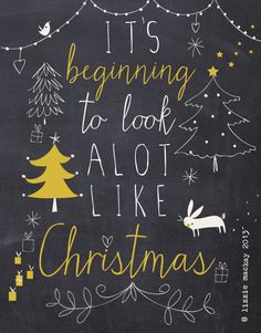 it's beginning to look alot like christmas written in chalk on a blackboard