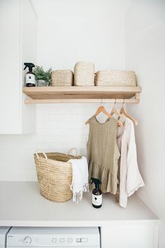 a washer and dryer sitting next to each other on top of a counter