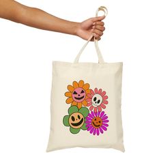 This 100% cotton bag comes in one size - 15" x 16"- perfect for everyday wear. While the canvas material will show off your designs in great colors, it's durable and will last for years. The bag features 20" handles (made from the same canvas), making it easy to carry even with a week's worth of shopping. .: 100% cotton canvas .: Heavy fabric (12 oz/yd² (406.9 g/m .: Sewn-in label Multicolor Cotton Bags For Everyday Use, Casual Multicolor Cotton Canvas Bag, Everyday Multicolor Cotton Bag, Everyday Multicolor Cotton Canvas Bag, Trendy Multicolor Cotton Shoulder Bag, Retro Canvas Tote Bag With Graphic Print, Cotton Shoulder Bag With Graphic Print For Shopping, Retro Graphic Print Canvas Tote Bag, Trendy White Cotton Canvas Bag