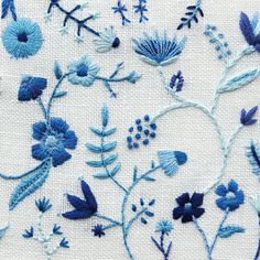 blue and white embroidered flowers on linen