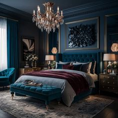 a bedroom decorated in blue and gold with a chandelier hanging above the bed