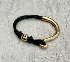 This wrap leather bracelet is handmade to order by me using real leather cord - 2mm, gold colour bead and gold colour clasp.  📌HOW TO CHOOSE YOUR BRACELET SIZE: - Using a flexible measuring tape, measure the smallest part of your wrist (the wrist joint, where your arm connects to your hand) - Ensure that it is tight around your wrist  - Add 0.25 inches for comfort - This is your bracelet size  Bracelet sizes are very individual and different for everyone and it is important to make sure that th Gold Minimalist Leather Bracelet, Minimalist Gold Leather Bracelet, Gold Leather Bracelets As Gift, Gold Leather Bracelet As Gift, Adjustable Gold Leather Bracelets, Adjustable Yellow Gold Leather Bracelet, Gold Leather Bracelet For Gift, Adjustable Leather Bracelet With Gold Clasp, Adjustable Gold Leather Bracelet Gift