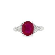 This 18K white gold stunning ring is from our Timeless Collection. It is made of a beautiful oval shape ruby in total of 3.06 Carat decorated by 2 colorless trillion shape diamonds in total of 0.70 Carat. Total metal weight is 5 gr. Extraordinary piece for any occasion! The Timeless Collection was inspired by the endless elegance and sophistication of classic high-jewelry, eternising it’s beauty and presenting a selection of classy designs. The intense colours stones give the collections authent Luxury Oval Ruby Ring Collectible, Luxury Oval Ruby Ring Fine Jewelry, Luxury Art Deco Oval Ruby Ring, Luxury Ruby And Diamond Oval Cabochon Ring, Luxury Ruby Ring With Single Cut Diamonds, Oval Shape, Trillion Diamonds, Diamond Cocktail Ring, Diamond Cocktail Rings, Intense Colors