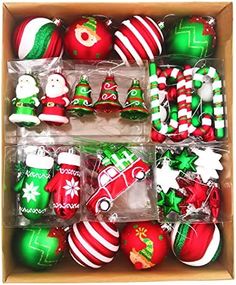 an open box filled with assorted christmas ornaments