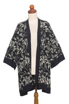 When it's slightly chilly out, cover up with Saktut Raitawati's beautiful kimono jacket. The Balinese artisan and her assistants craft the open-front jacket from 100% rayon with a hand-batik leaf pattern in white that contrasts beautifully with the jacket's black base. Cotton Open Front Kimono For Fall, Fall Cotton Open Front Kimono, Traditional Open Front Outerwear For Spring, Summer Long Sleeve Kimono With Batik Print, One Size Floral Print Kimono For Fall, Floral Print Wrap Kimono For Fall, Spring Traditional Open Front Outerwear, Traditional Open Front Spring Outerwear, Traditional Spring Beach Outerwear