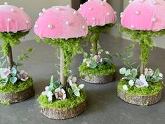 four pink mushrooms with white pearls on them