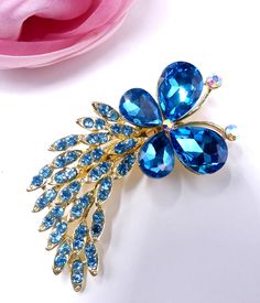 "Vintage pretty gold tone and blue rhinestone butterfly with tail pin brooch, In very good condition, It's 2'3/4 long 1\"1/4 wide, Thanks" Blue Butterfly Accessories, Elegant Blue Butterfly Brooches, Butterfly With Tail, Mertensia Virginica, Vintage Gold Brooch, Stone Bangles, Delicate Jewellery, Stone Bangle, Butterfly Jewelry