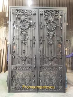 an iron door is being worked on