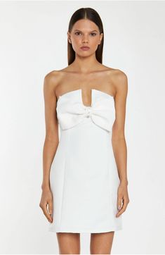 Glamorous Women's Off-White Satin Strapless Bow Mini-Dress. This Off-White Strapless Mini Dress is the ultimate showstopper! Its statement bow design, tailored fit, and mini length are sure to turn heads. Its sparkling diamante trim details finishes off the look perfectly! FEATURES Statement Bow Design Strapless Tailored Fit Mini Length Diamante Trim Details Fully lined Concealed Zip Fastening at the Back Composition: Shell 100% Polyester, Lining 100% Polyester Model Wears Size 10. Model Height: Strapless Mini Dress With Bow For Gala, Elegant Strapless Mini Dress With Satin Bow, Chic Strapless Mini Dress With Detachable Bow, Strapless Mini Dress With Detachable Bow For Evening, Formal Strapless Mini Dress With Bow, Formal Strapless Mini Dress With Bow Tie Back, Elegant Fitted Strapless Dress With Bow Tie Back, Elegant Strapless Dress With Satin Bow, Formal Fitted Strapless Dress With Satin Bow