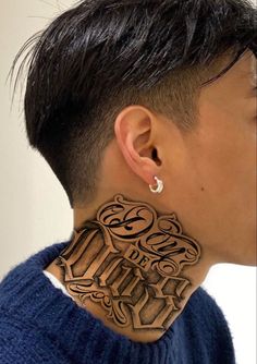 a woman with a tattoo on her neck