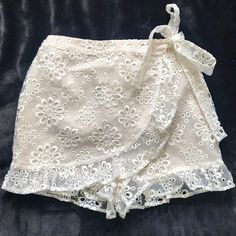 Revolve Lovers & Friends Faux Wrap Organza Shorts Cream Elastic Pull On Faux Wrap Shorts Embroidered Organza Ruffle Hem Waist 13” Stretches To 16” New Without Tags Feminine Short Bottoms For Party, Fitted Lace Bottoms For Day Out, Spring Lace Bottoms For Day Out, White Lace Bottoms For Brunch, White Lace Brunch Bottoms, Chic Lace Bottoms For Vacation, White Lace Bottoms For Day Out, Friends Shorts, Wrap Shorts