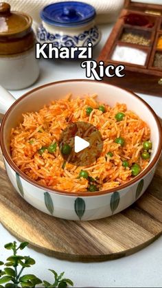 a bowl filled with rice sitting on top of a wooden cutting board