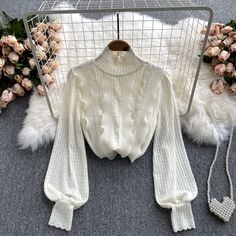 Feminine Long Sleeve Stretch Sweater, White Feminine Sweater For Fall, White Long Sleeve Lace Patchwork Top, White Long Sleeve Tops With Lace Sleeves, White Long Sleeve Lace Top With Patchwork, Winter Long Sleeve Lace Patchwork Top, White Lace Top With Lace Sleeves For Fall, Fitted Long Sleeve Sweater With Lace Trim, Feminine Cream Long Sleeve Sweater