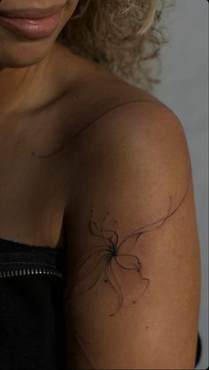 a woman with a tattoo on her arm