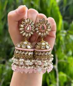 Beautiful engraved Jhumka earrings available in 2 stunning variations of pink and green. These earrings are high quality and are made to last. They are not too heavy and will be fine to wear all day long. They surely add a statement to any look! In case of any queries, please feel free to reach out. Happy shopping! Luxury Jhumkas With Intricate Design For Formal Occasions, Luxury Traditional Kundan Jhumkas, Cheap Festive Jhumkas For Navratri, Cheap Multicolor Jewelry For Diwali, Cheap Round Jhumkas With Latkans, Luxury Kundan Jhumkas With Zari Work, Luxury Green Jhumkas For Diwali, Luxury Fusion Jhumkas As Gift, Luxury Multicolor Earrings For Diwali