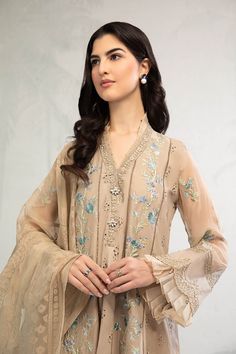 Try a new Maria B Pakistani Kameez Salwar Suit Embroidered Paneled Party Dress that is an elegant masterpiece that will give you a stunning look with its Gold color in Paneled pattern. Hand-crafted embellishments and threads make this kameez salwar suit an epitome of beauty. Lawn Paneled Kameez: The beautiful kameez is graceful floral designs with details of motifs and sequins enhance the charm of this perfectly stitched kameez salwar with beautifully embellished sleeve borders in an alluring Go Pakistani Kameez, Maria B Lawn, Raw Silk Fabric, Maria B, Organza Dupatta, Net Dupatta, Suit Fabric, Trouser Style, Salwar Suit