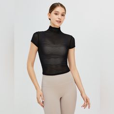 Features: Basic Style Sheer: Sheer Stretch: Highly Stretchy Material Composition: 85% Polyamide, 15% Spandex Care Instructions: Machine Wash Cold. Tumble Dry Low. Imported Product Measurements: S:Bust 28.35 In, Sleeve Length 4.33 In, Top Length 19.29 In M:Bust 29.92 In, Sleeve Length 4.65 In, Top Length 20.08 In L:Bust 31.50 In, Sleeve Length 4.96 In, Top Length 20.87 In Xl:Bust 33.07 In, Sleeve Length 5.28 In, Top Length 21.65 In Fitted Mesh Top For Workout, Stretch Mesh Tops With Short Sleeves, Stretch Mesh Top With Crew Neck, Mesh Short Sleeve Workout Tops, Fitted Mesh Workout Top, Fitted Short Sleeve Top For Yoga, High Stretch Mesh Tops For Sports, Sporty Fitted Top For Workout, Fitted Mesh Top For Athleisure