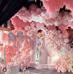 a room filled with balloons and decorations