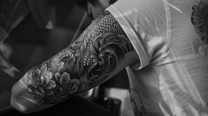 Black and white sleeve tattoo design showcasing intricate floral patterns and mythological creatures. Black And White Sleeve Tattoo, White Sleeve Tattoo, Tattoo Sleeve Designs, Mythological Creatures, White Image, Sleeve Tattoo, Minimalist Tattoo, Floral Patterns