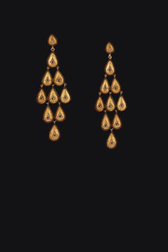 Radiate elegance with the enchanting sparkle of Diamond Drops Chandelier Earrings in textured gold. Featuring vibrant polki diamonds set in luxurious gold, each earring cascades in a graceful chandelier design, capturing light with every movement. An ultimate blend of sophistication and striking beauty, these dangle earrings are perfect for adding a touch of glamour to your outfits. Metal: 24K Gold Vermeil Polki Diamonds: 0.28 ctw Length: 3 inches One of a Kind handmade item Note: These gorgeous earrings were chosen by Ann Hathaway for the Oscars 2016 Ceremony and Vanity Fair after-party Luxury Yellow Gold Teardrop Chandelier Earrings, Luxury Drop Chandelier Earrings With Intricate Design, Luxury Intricate Design Drop Chandelier Earrings, Luxury Intricate Design Chandelier Drop Earrings, Luxury Yellow Gold Drop Chandelier Earrings, Luxury Yellow Gold Chandelier Drop Earrings, Luxury Gold-plated Chandelier Dangle Earrings, Festive Yellow Gold Chandelier Drop Earrings, Gold Diamond Chandelier Earrings With Elegant Design