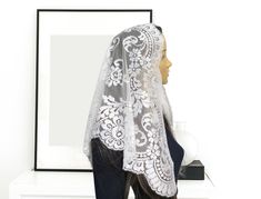 Vintage, Chapel Spanish Mantilla is made of a  high quality  very light french lace. Color -White This mantilla is very elegant with a feminine look. It measures 44" X 23" Check this mantilla in other veil available in our store You can purchase the sewn snap comb to secure mantilla in place and prevent from slipping https://www.etsy.com/listing/825065625/add-a-snap-comb-sewn-to-your-veil-veil?ref=shop_home_active_1&frs=1 Some of our veils/mantillas are already made ready to ship and some are cu White Fitted Lace Veil, Fitted White Veil, Elegant Fitted Veil With Lace Trim, Fitted White Lace Veil, Elegant White Scalloped Lace Veil, Elegant White Lace Veil, Elegant White Lace With Contrast Detailing, Mass Veil, Veil Scarf