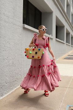 Blair Eadie wears a red gingham dress with pom poms by SUNDRESS // Bag by Nannacay // Sunglasses by Celine // Click through for more pom pom outfit picks and summer dress style on Atlantic-Pacific Gingham Outfit, Beach Fashion, 2019 Fashion