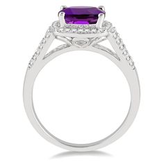 10K White Gold Cushion Cut Amethyst Ring with Diamond Halo and Accent Stones Center Stone: Amethyst Center Stone Shape: Cushion Center Stone Size: 8x8mm Diamond Shape: Round Total Diamond Weight: 0.25ct Stock Size: 7 Free ring sizing available in-store with purchase, contact us for more details. Purple Cushion Cut Brilliant Ring, Fine Jewelry Purple Halo Design Rings, Purple Brilliant Cushion Cut Rings, Purple Halo Design Fine Jewelry Ring, Purple Diamond Rings With Halo Design, Formal Purple Birthstone Ring With Halo Setting, Formal Purple Halo Birthstone Ring, Amethyst Rings With Diamond Accents And Round Cut, Amethyst Rings With Diamond Accents, Round Cut