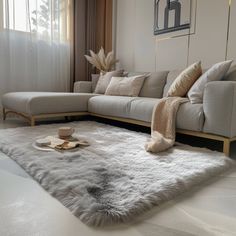 a living room filled with furniture and pillows