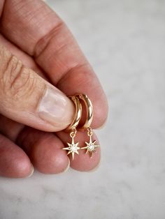 "Dainty Gold Earrings, Gold Hoop Earrings, Minimalist Earrings, Gift for Her, Mother`s Day Gift, 14k Gold Filled Mini North Star CZ Hoop Huggies, Dainty Delicate Earrings, Simple Boho Layering Earrings, Bridal Best Friend Girlfriend Gift A tiny pair of endless hoop huggies featuring a tiny CZ North Star charm. Delicate earrings with a lot of style. It's simplicity brings an effortless bohemian glam - perfect for everyday styling! D e t a i l s: => Metal Type - Gold Filled Hoops / CZ Gold Plated Layering Earrings, Kids Jewellery, Dainty Gold Earrings, Star Charm Necklace, Boho Layering, Earring Ideas, Mini Hoop Earrings, Paris Outfits, Earrings Simple