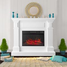 a living room with a fire place in the center and decorations on the floor next to it