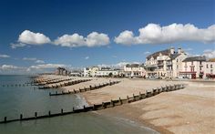 the beach is lined with houses and water