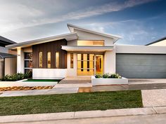 this is a rendering of a modern house in the suburbs with two garages and an attached driveway