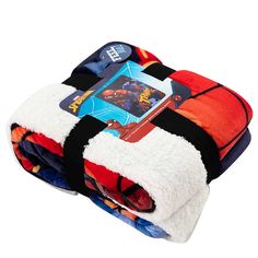 the spiderman blanket is folded up and ready to be used as a baby toy