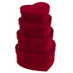 four red heart shaped cushions stacked on top of each other