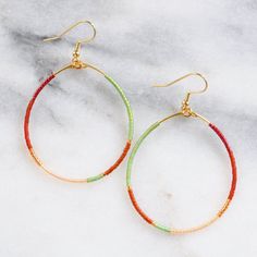 You asked for bigger beaded hoops and Libby & Smee answered! These dangly seed bead hoop earrings are the pieces you'll grab every day when you want a little something fun without a lot of fuss. Bonus: They look great dressed up or super casual. It's no surprise that they've become the Libby & Smee cult favorite. beaded hoops with tiny glass seed beads available in two large sizes: BIG, a teardrop shape approximately 1.75 inches wide and 2.75 inches long, or BIGGER, a circle shape 2.25 i Beads Style, Muted Green, Jackson Hole Wyoming, Plastic Earrings, Earring Cards, Beading Wire, Jackson Hole, Beaded Hoop Earrings, Beaded Hoops