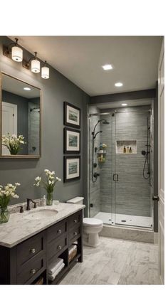 a bathroom with gray walls and white fixtures