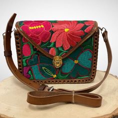 "Beautiful colorful Hand Embroidered Mexican Flower Bag made in Chiapas, Mexico. Each bag is hand embroidered and flower will vary but each one is beautiful and unique Adjustable Strap 7\" Tall 8\" Wide" Green Embroidered Crossbody Shoulder Bag, Spring Green Floral Embroidered Shoulder Bag, Traditional Handmade Bags For Spring, Traditional Handmade Bag For Spring, Multicolor Embroidered Floral Pouch Bag, Multicolor Floral Embroidery Shoulder Bag As Gift, Green Shoulder Bag With Floral Embroidery, Green Rectangular Shoulder Bag With Floral Embroidery, Traditional Bags With Floral Embroidery For Spring