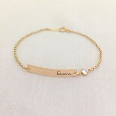 Baby Girl Bar Bracelet, Gold Bar with Crystal Bracelet, Baby Jewelry, Christening Gift, Bridesmaid Bracelet, Name Bracelet, Personalized BarAvailable in Sterling Silver, 14K Gold Filled, 14K Rose Gold FilledPlease drop a message of name in the note box at checkout.Specification. All component is Sterling Silver / 14K Gold Filled/ 14K Rose Gold Filled. Bar size 5 x 30mm. Crystal CZ size 4mm. Thicker Rolo Chain. Comes in a satin pouch. Length includes bar, jump ring and claspIMPORTANT:Usually jewe Dainty Engraved Gold Adjustable Bracelet, Adjustable Engraved Name Bracelet For Bridesmaid Gift, Dainty Adjustable Nameplate Bracelet, Adjustable Stackable Gold Bracelet For Wedding, Custom Name Adjustable Wedding Bracelets, Gold Hand Stamped Wedding Bracelets, Custom Name Adjustable Bracelets For Wedding, Customizable Nameplate Bracelets For Wedding, Personalized Wedding Chain Bracelet