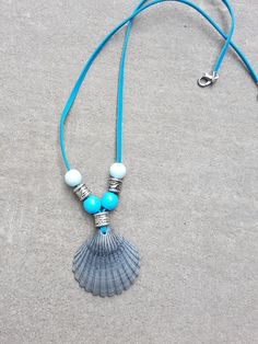 A beautiful sea colour bead scallop shell necklace.Perfect for summer. Perfect gift for Mothers Day. Light Blue Round Bead Necklaces For The Beach, Blue Shell Necklace For Summer, Light Blue Round Beads Necklace For The Beach, Light Blue Round Beads Necklace For Beach, Summer Turquoise Shell Necklaces, Adjustable Blue Shell Necklace For Gift, Blue Shell Jewelry As A Gift, Blue Shell Jewelry For Gifts, Turquoise Shell Necklace For Gift