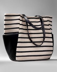 Casual and chic in a bold nautical stripe, this canvas herringbone carry all is strong and stylish. With side storage pockets, faux leather straps, full lining and pocketed interior. 100% Cotton. Chic Travel Bag With Striped Lining, Striped Bag With Leather Handles For Everyday Use, Everyday Striped Bags With Leather Handles, Black Travel Bag With Striped Lining, Chic Shoulder Bag With Striped Lining, Chic Shoulder Bag With Striped Lining For Everyday, Chic Striped Shoulder Bag For Everyday, Everyday Use Canvas Tote Bag With Striped Lining, Everyday Tote Canvas Bag With Striped Lining