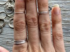 "Sterling silver stacking ring | Dainty silver midi rings | Tiny mid finger rings | Little sterling silver stacking rings | Knuckle ring This listing is for one sterling silver stacking ring. They are hand spun, soldered, hammered and tumbled to create a sweet little stacker. If your size is unavailable, please select \"custom\" from the drop down menu and indicate the size you need at check out. Our jewelry is unique and one-of-a-kind. Please note there will likely be variances in the size, shape and color of each stone. All elements of your piece are handcrafted in our tiny studio on the island of Martha's Vineyard. Your jewelry will arrive ready for gift-giving in hand-stamped, earth-conscious packaging. In stock pieces are shipped in 1-3 business days. If you purchase a custom piece or Tiny Silver Sterling Stackable Rings, Tiny Silver Stackable Sterling Silver Rings, Tiny Open Sterling Silver Midi Rings, Dainty Handmade Silver Stackable Rings, Minimalist Hand-forged Silver Stackable Rings, Mid Finger Rings, Midi Rings Silver, Tiny Studio, Sterling Silver Stacking Rings