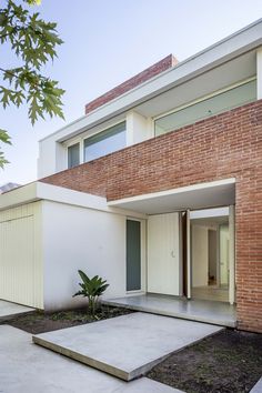 an empty courtyard in front of a brick building