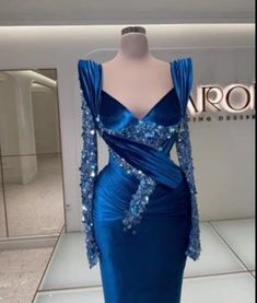 Fabric: Charmeuse; Silhouette: Sheath/Column; Neckline: Queen Anne; Hemline/Train: Floor-Length; Embellishment: Beadings; Sleeve: Long Sleeves; Waist: Natural; Back Style: Zipper; Built-In Bra: Yes; Shown Color: Royal Blue; Season: Spring; Summer; Fall; Winter; Blue Embellished Mermaid Dress For Evening, Blue Embellished Fitted Mermaid Dress, Blue Mermaid Dress With Sequins For Banquet, Blue Sequined Mermaid Dress For Banquets, Blue Sequined Mermaid Dress For Banquet, Fitted Royal Blue Embellished Gown, Blue Mermaid Dress With Sequined Fitted Bodice, Blue Sequined Fitted Gown, Blue Embellished Fitted Evening Dress