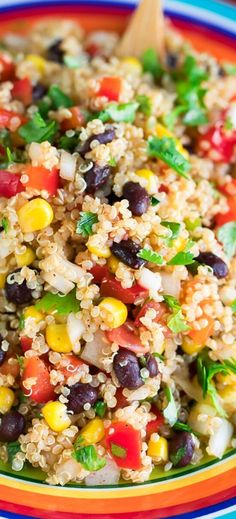 a colorful bowl filled with rice and vegetables