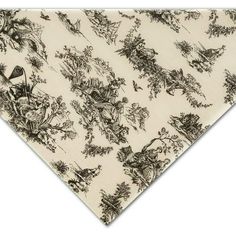 a black and white dog bandana with an image of birds, flowers and trees on it