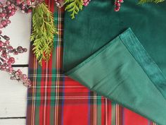 green and red plaid fabric next to christmas decorations