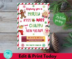 a christmas card with the words merry kiss and happy new year on it, next to pine cones